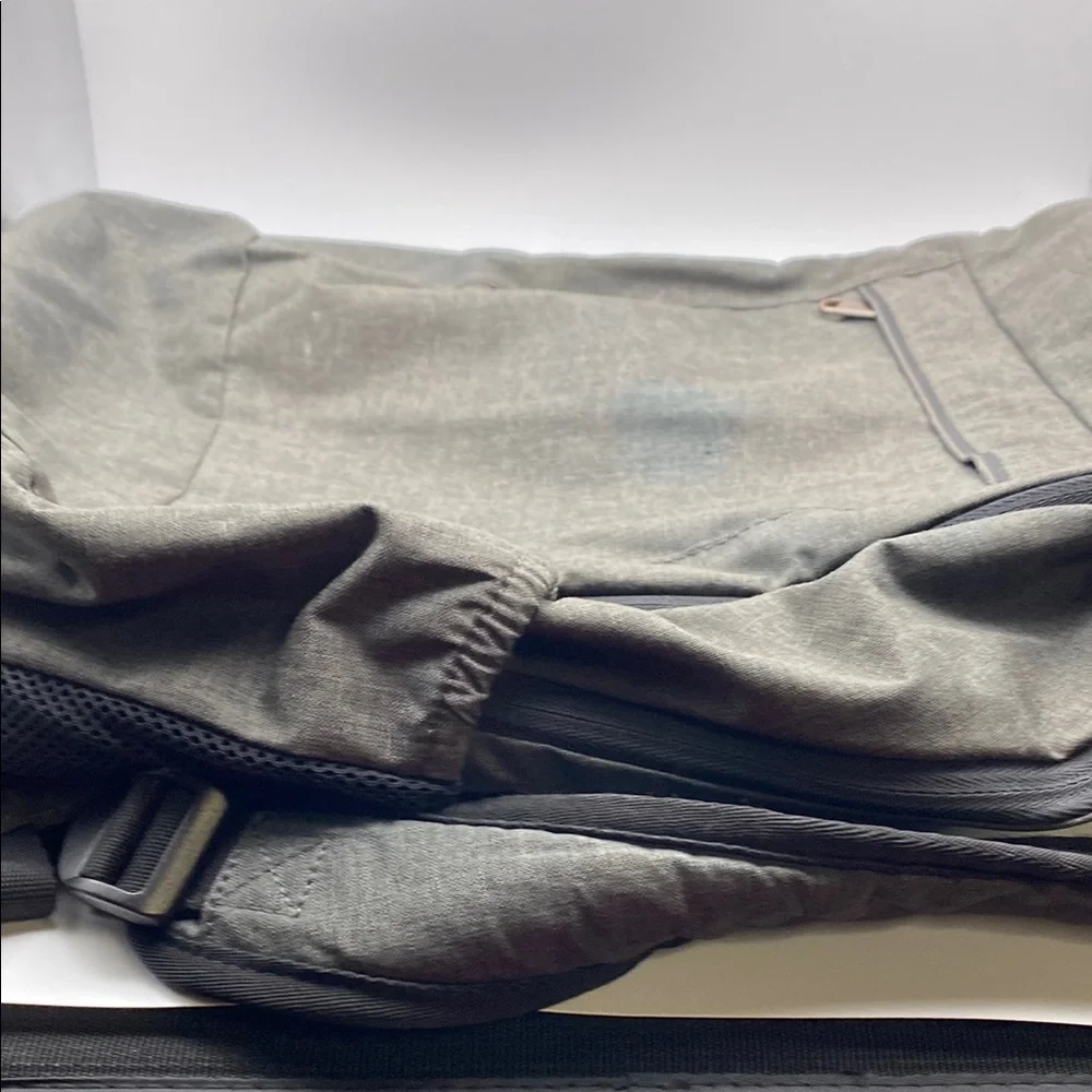 Gray Modern Backpack With Adjustable Straps And Bronze Metal Hardware